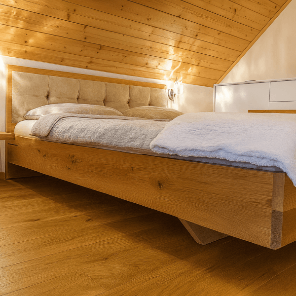 Modern wooden bed with a tufted headboard in a cozy attic bedroom setting.